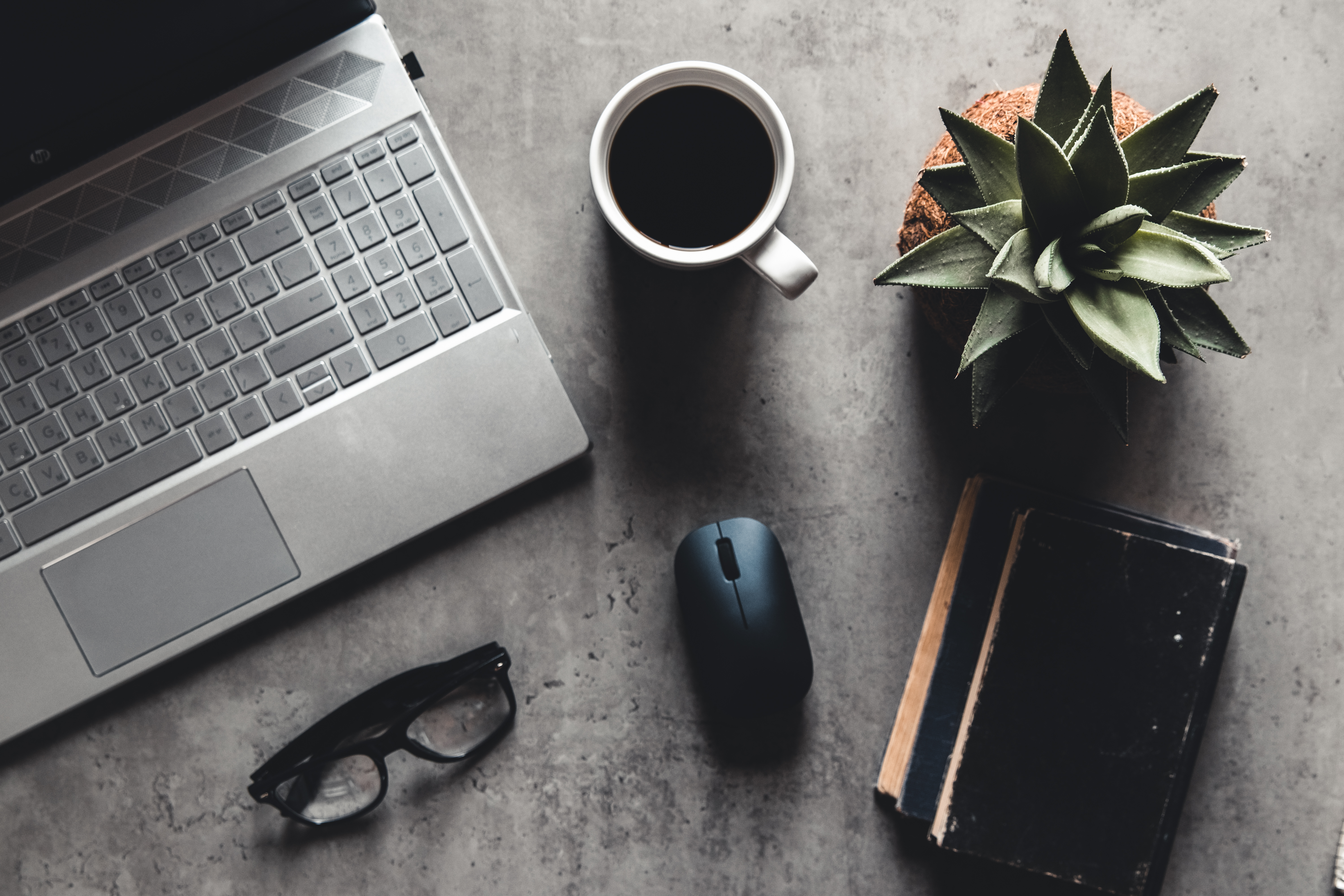 laptop-and-book-coffee-on-gray-background-top-vi-2023-11-27-05-14-55-utc_01929fde10e774b1aef36b017e2fd58f